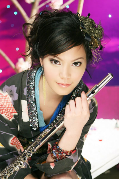 Sandy holding her flute in a colorful portrait